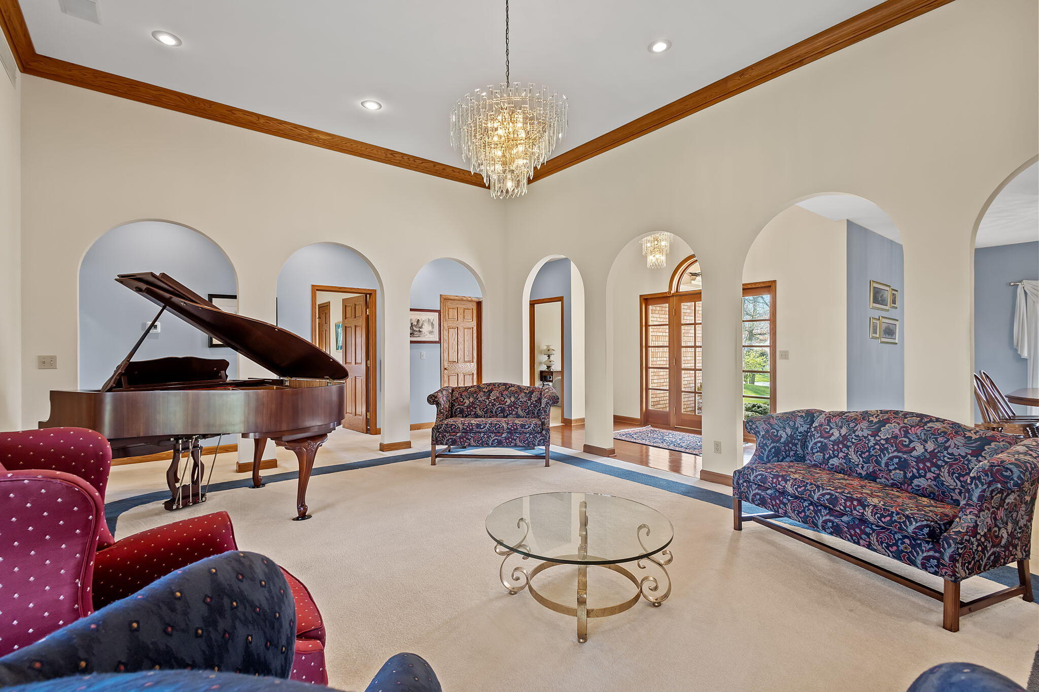 6664 Ridgeview Drive Demotte, IN 46310 - Photo 17 of 65 a living room with furniture a couch and chandelier