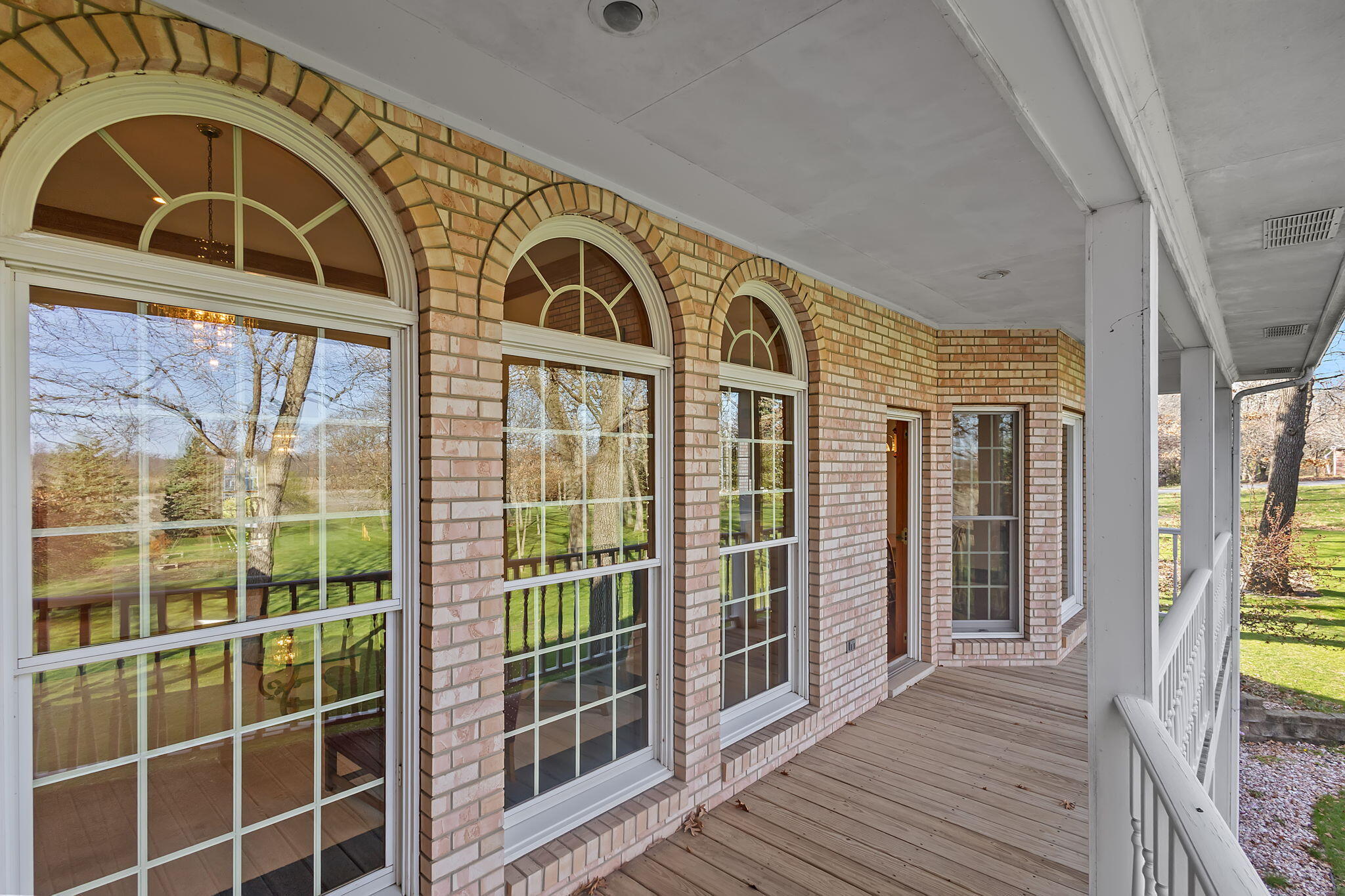 6664 Ridgeview Drive Demotte, IN 46310 - Photo 21 of 65 a view of a brick house with a large window