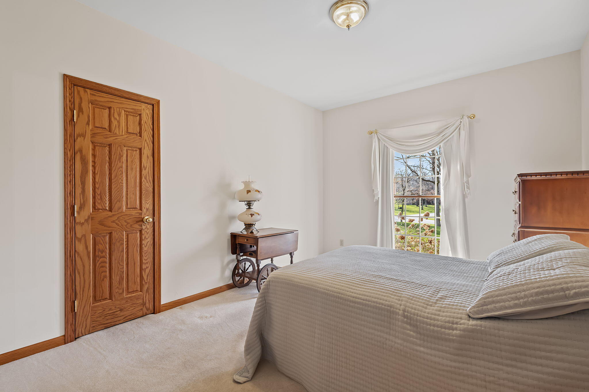 6664 Ridgeview Drive Demotte, IN 46310 - Photo 26 of 65 a bedroom with a bed and a window