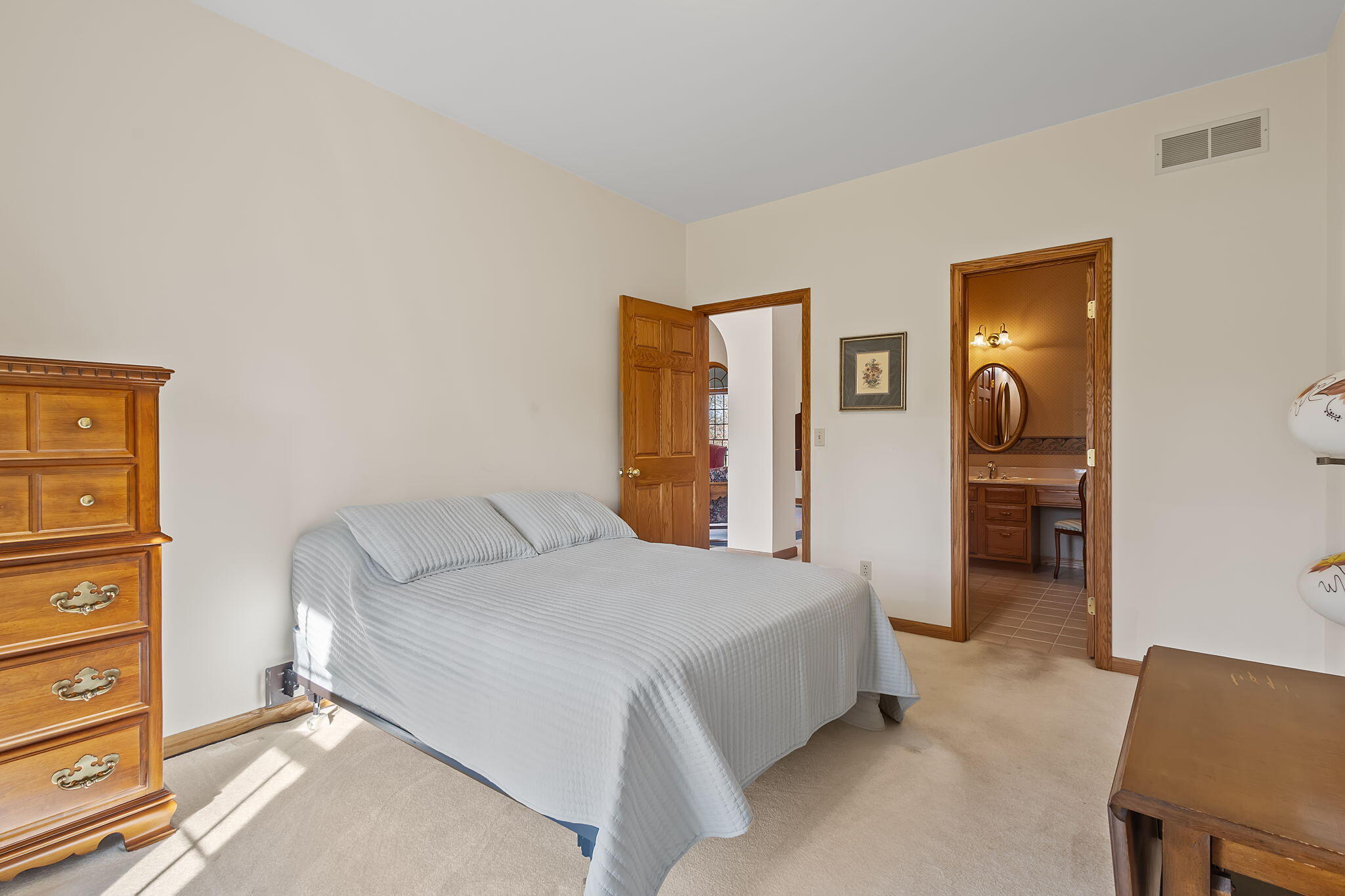 6664 Ridgeview Drive Demotte, IN 46310 - Photo 27 of 65 a bedroom with a bed and a chair