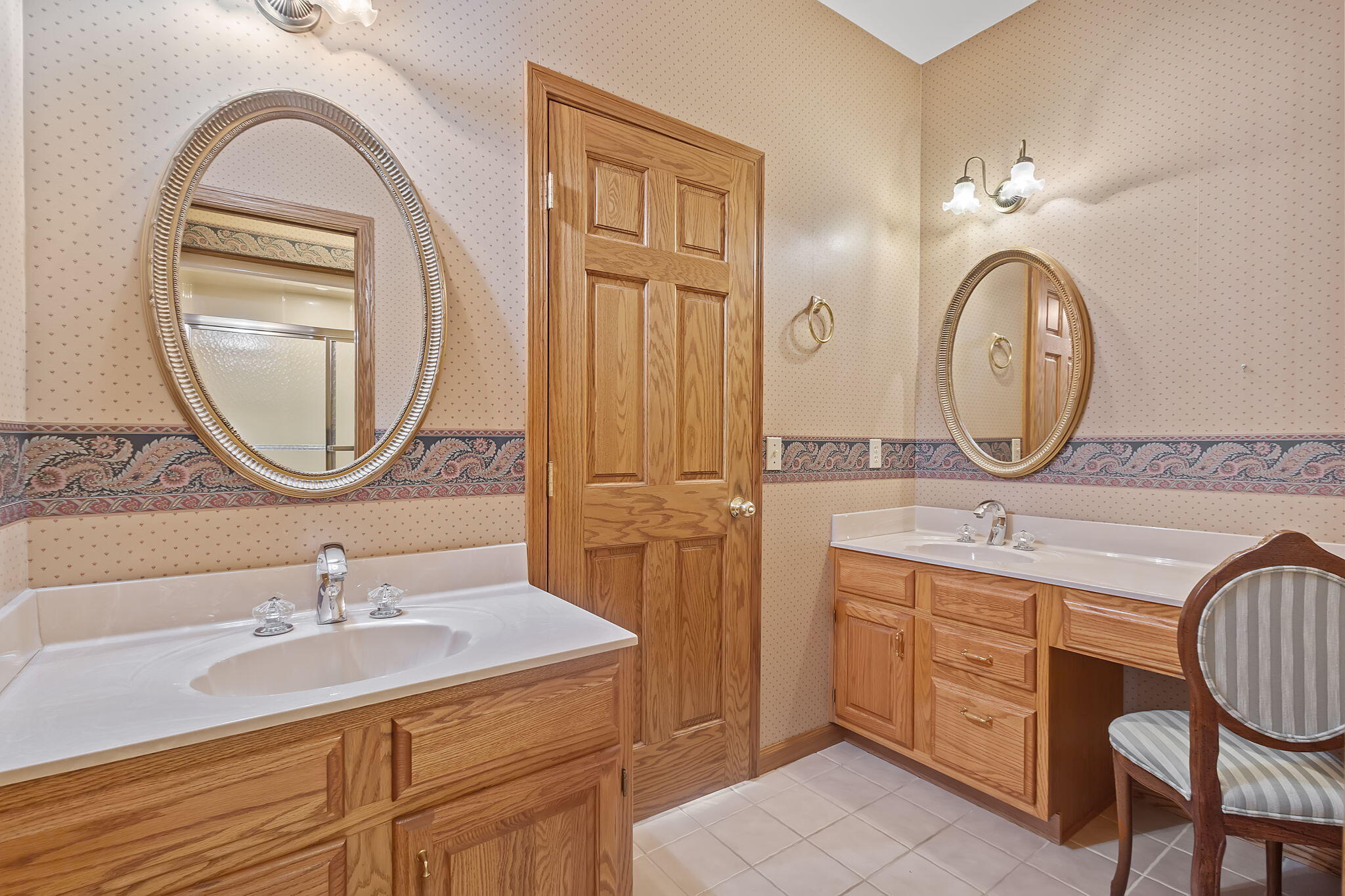 6664 Ridgeview Drive Demotte, IN 46310 - Photo 28 of 65 a bathroom with a granite countertop double vanity sink and a mirror