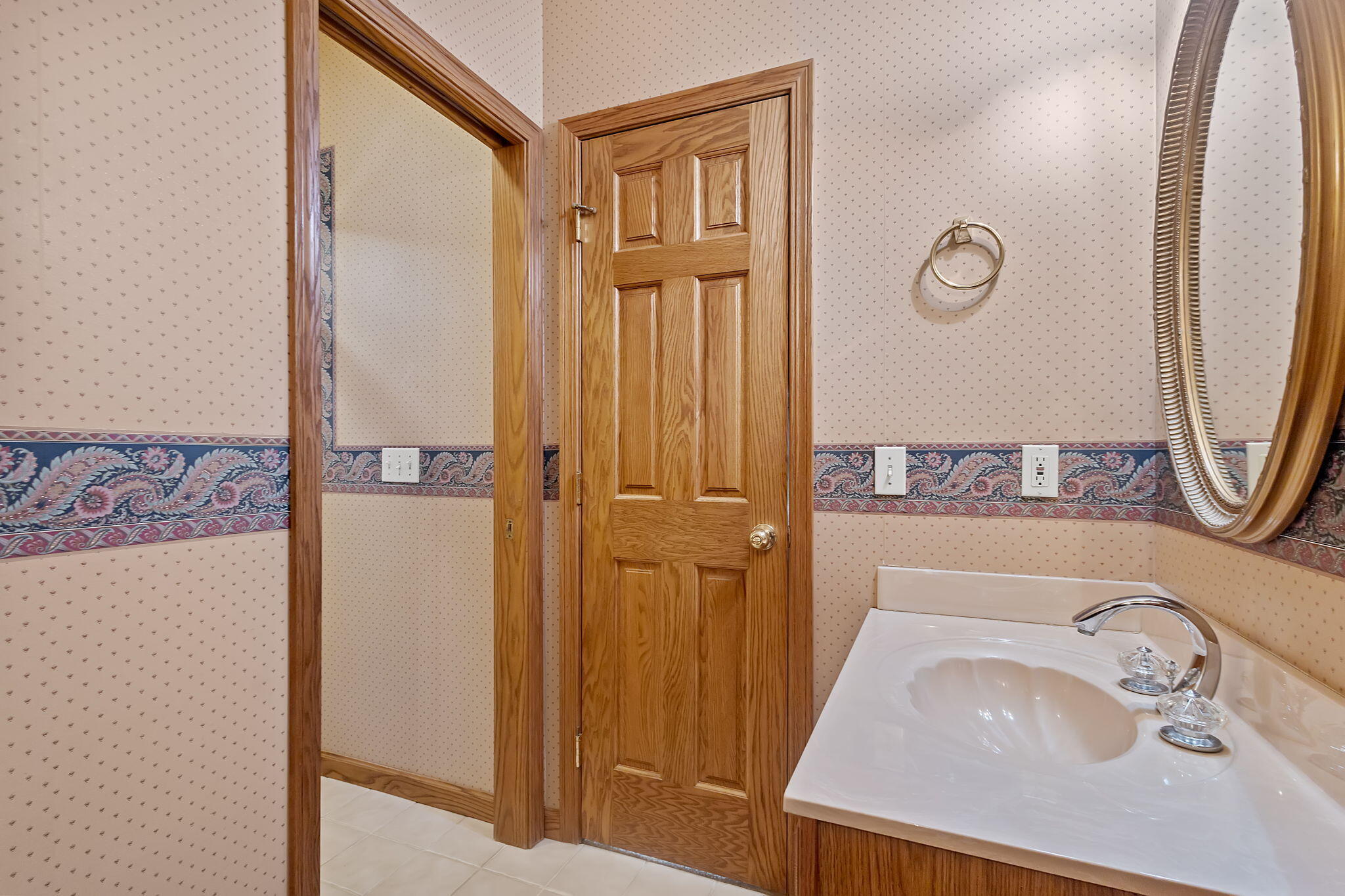 6664 Ridgeview Drive Demotte, IN 46310 - Photo 29 of 65 a bathroom with a sink a mirror and shower