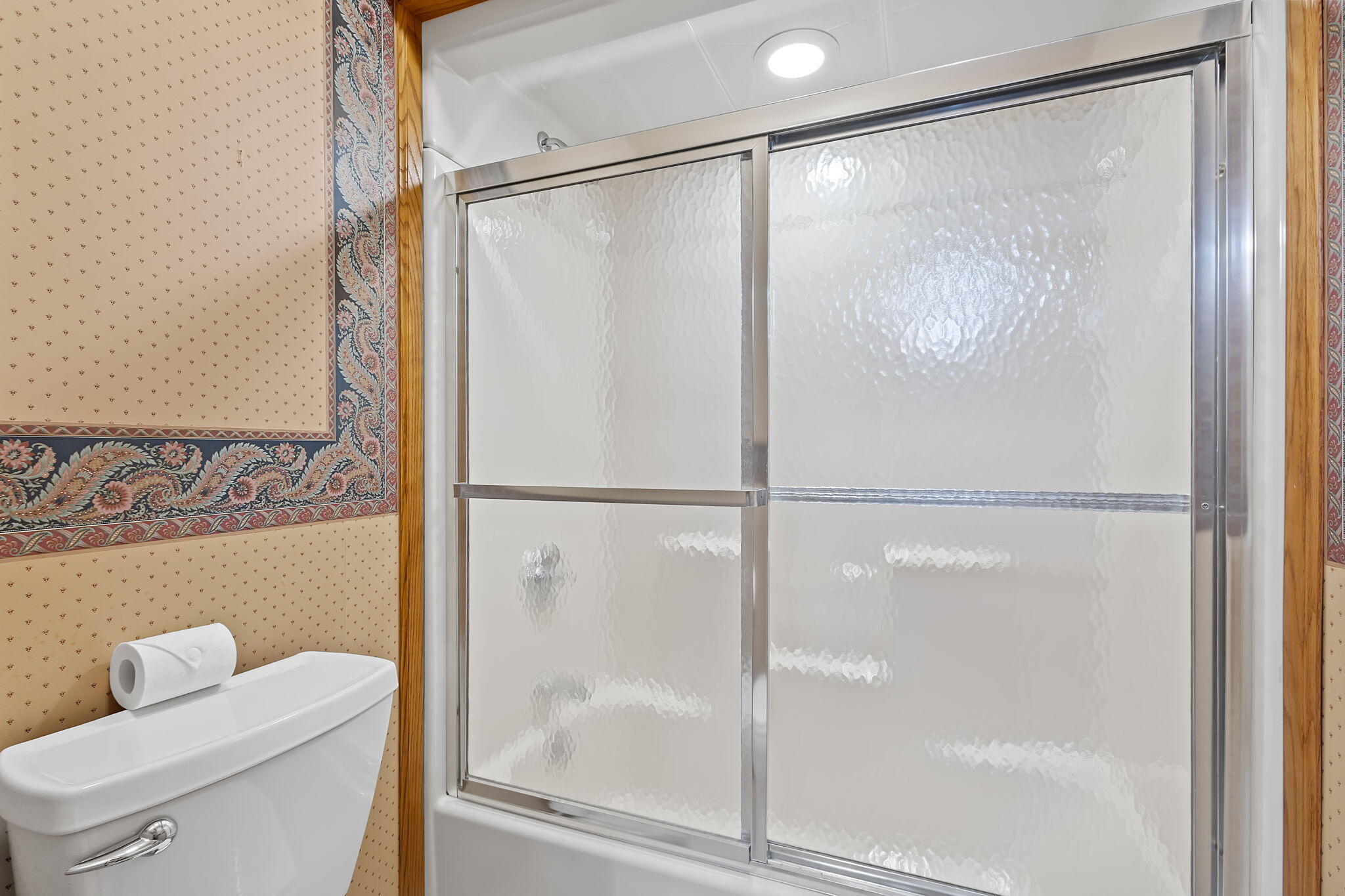 6664 Ridgeview Drive Demotte, IN 46310 - Photo 30 of 65 a bathroom with a glass shower door