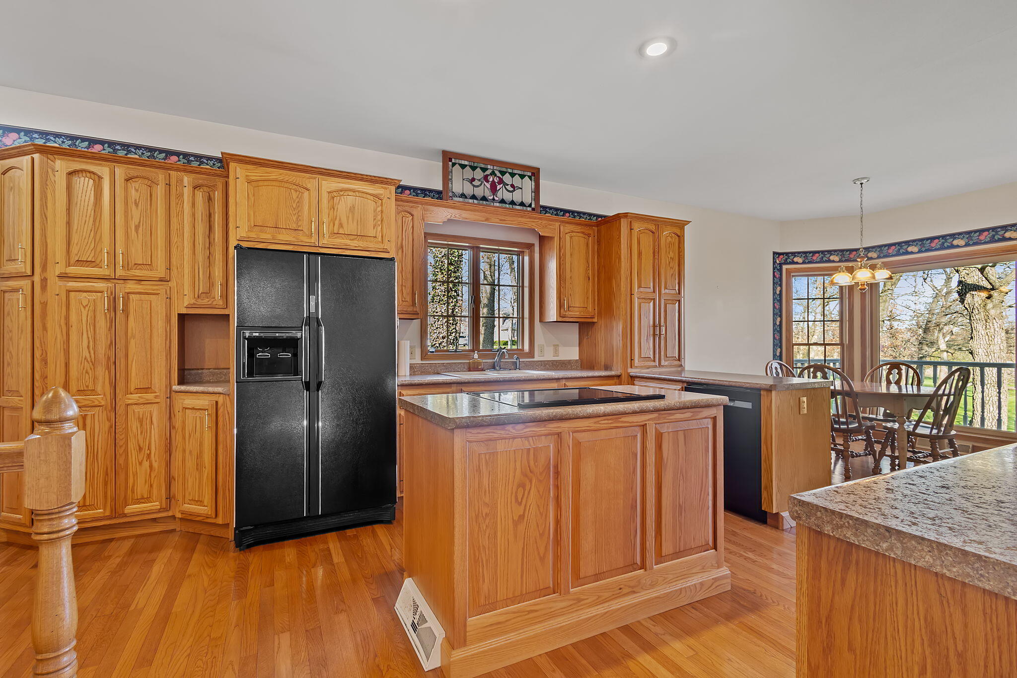 6664 Ridgeview Drive Demotte, IN 46310 - Photo 3 of 65 a kitchen with stainless steel appliances granite countertop a refrigerator and a stove top oven