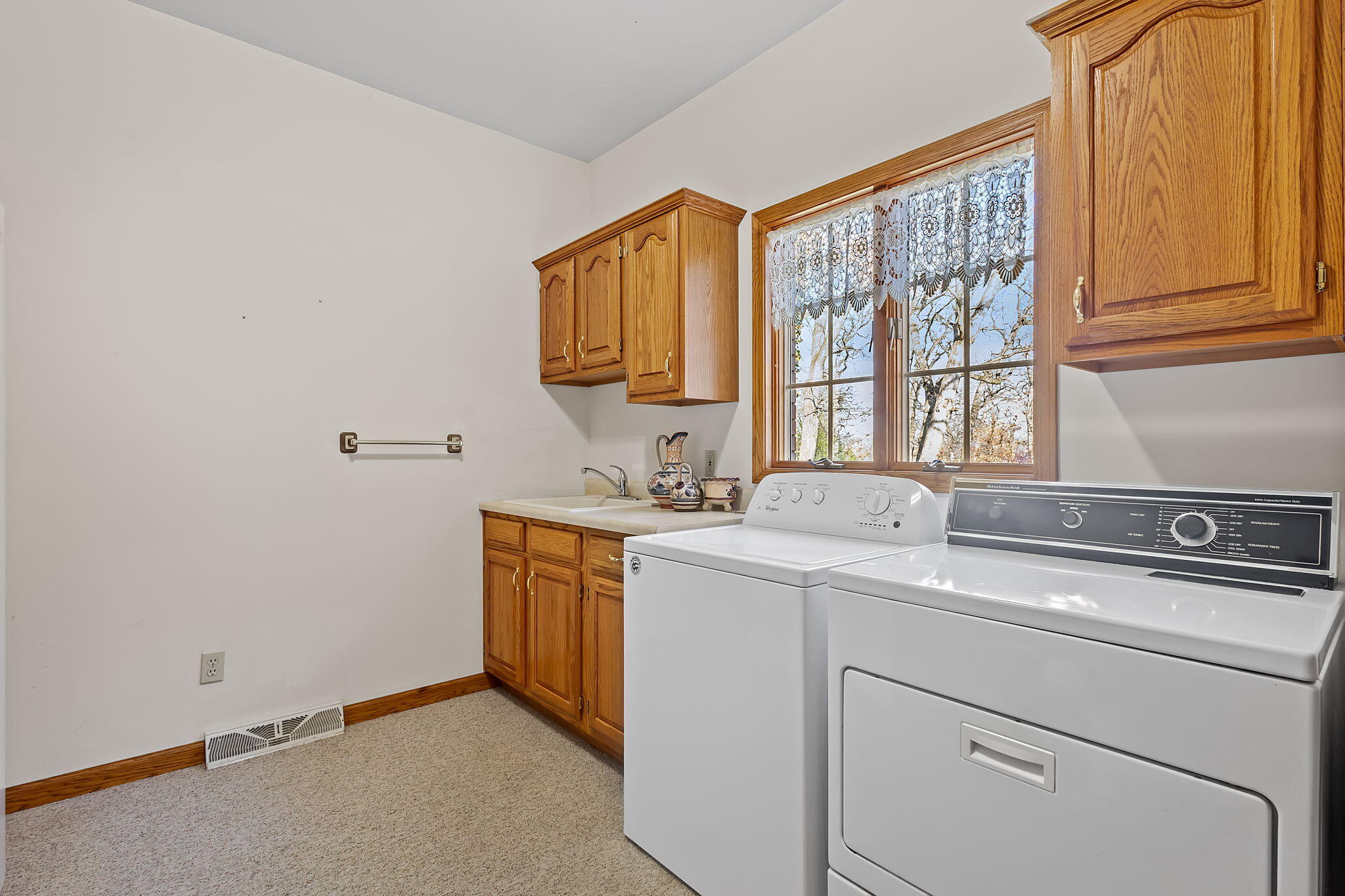 6664 Ridgeview Drive Demotte, IN 46310 - Photo 34 of 65 a utility room with dryer and washer