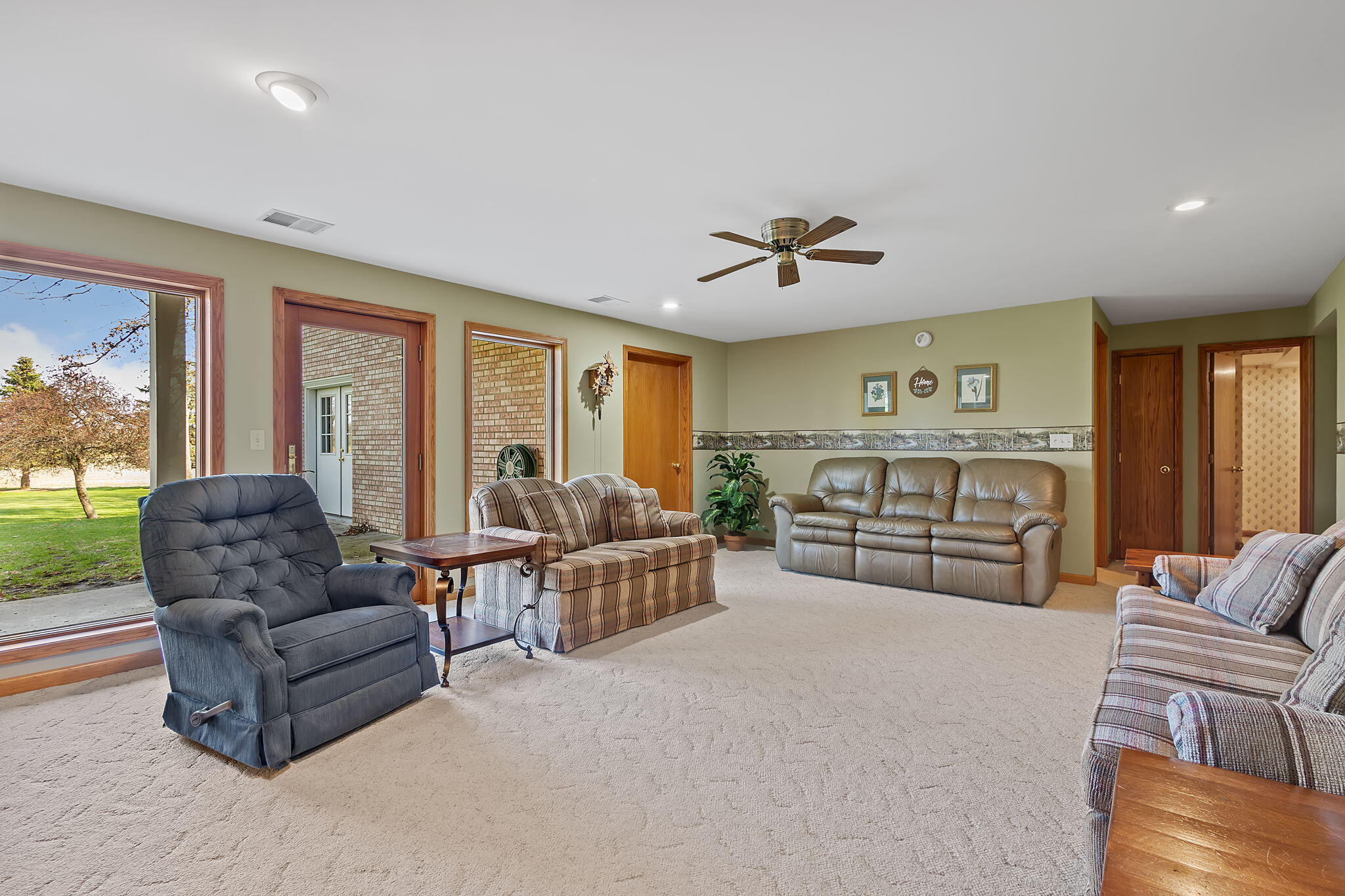 6664 Ridgeview Drive Demotte, IN 46310 - Photo 36 of 65 a living room with furniture and a large window