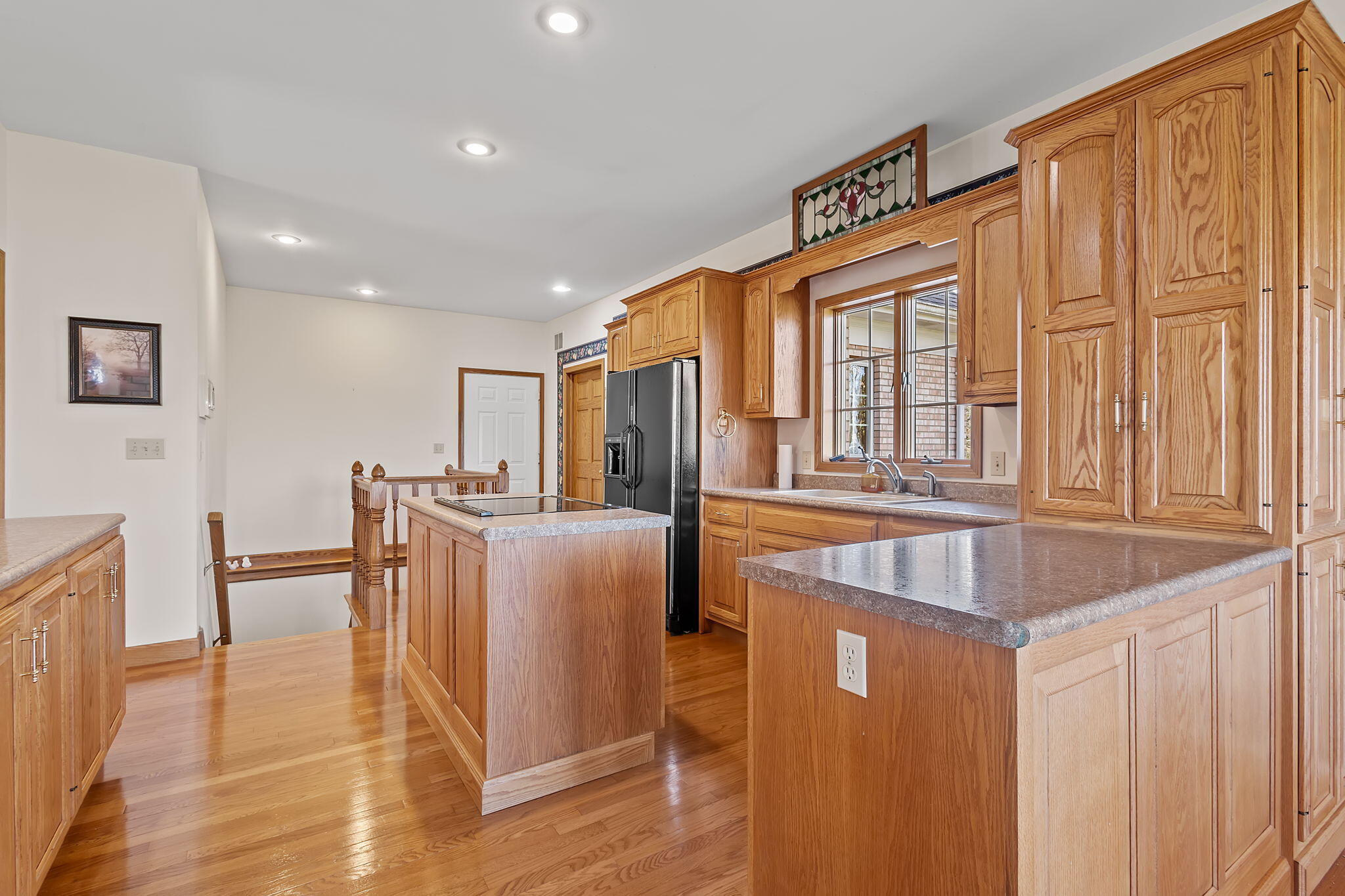 6664 Ridgeview Drive Demotte, IN 46310 - Photo 4 of 65 a kitchen with stainless steel appliances granite countertop a refrigerator and a sink