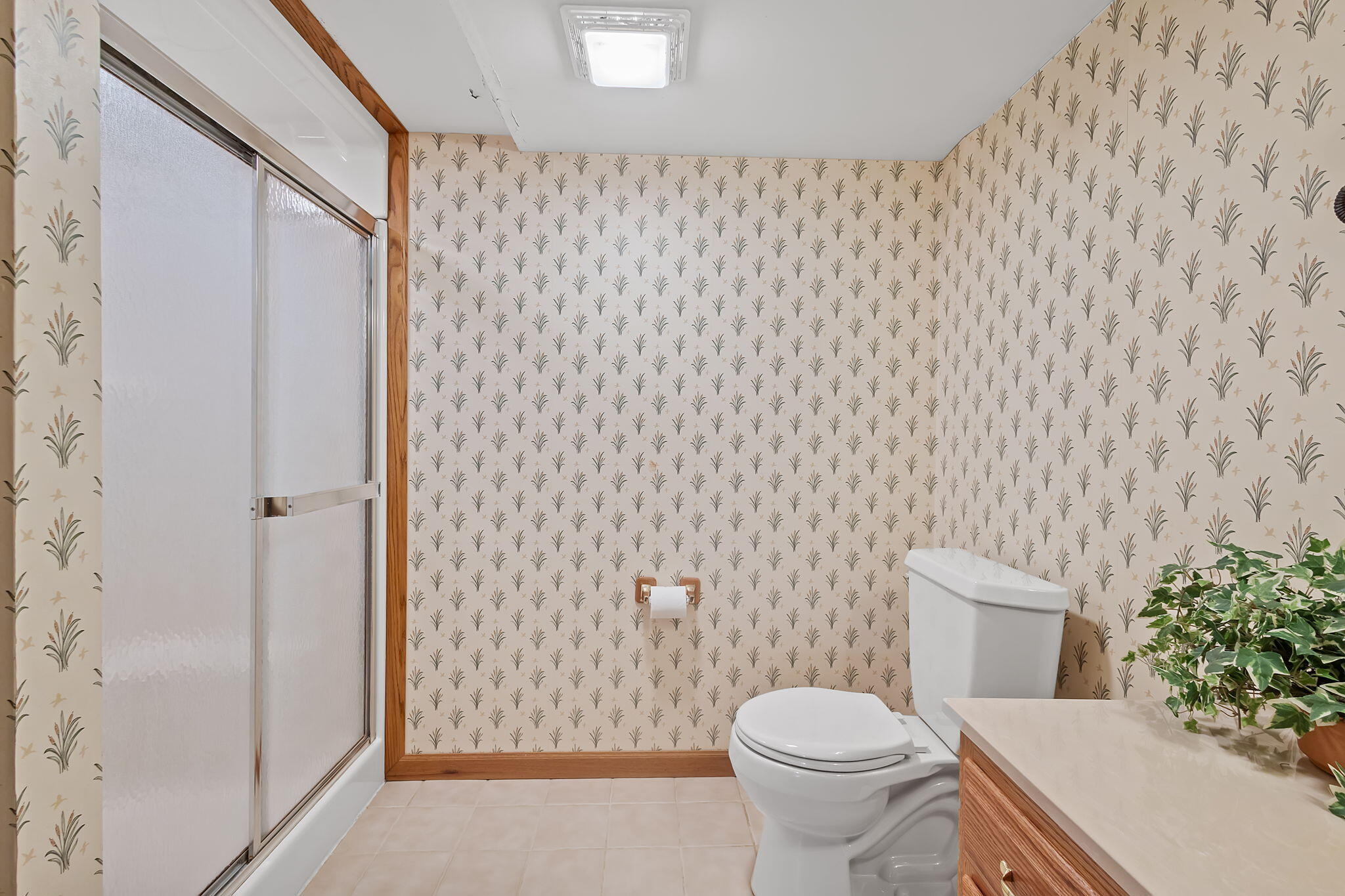 6664 Ridgeview Drive Demotte, IN 46310 - Photo 44 of 65 a white toilet sitting next to a shower curtain