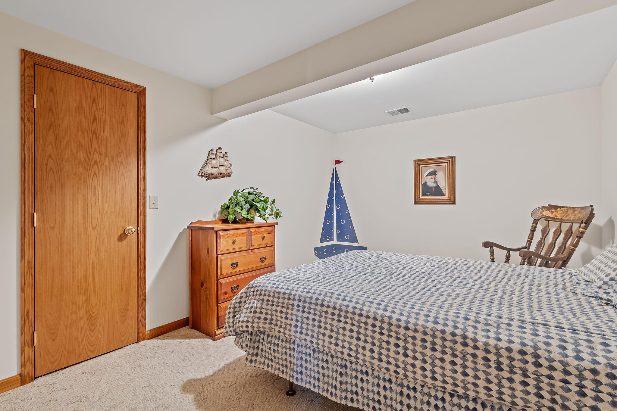 6664 Ridgeview Drive Demotte, IN 46310 - Photo 47 of 65 a bedroom with a bed and a dresser