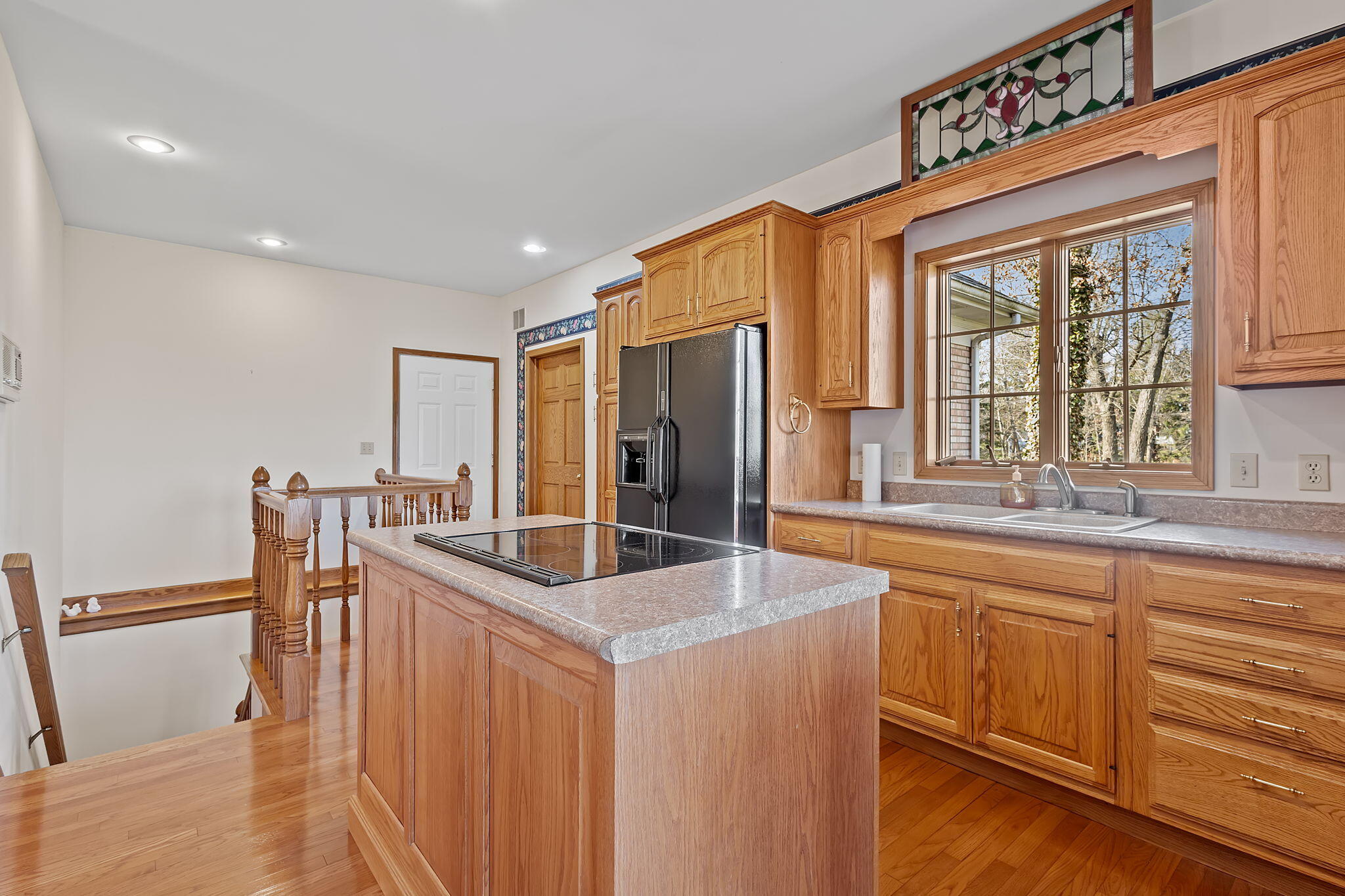 6664 Ridgeview Drive Demotte, IN 46310 - Photo 5 of 65 a kitchen with stainless steel appliances granite countertop a sink and a refrigerator