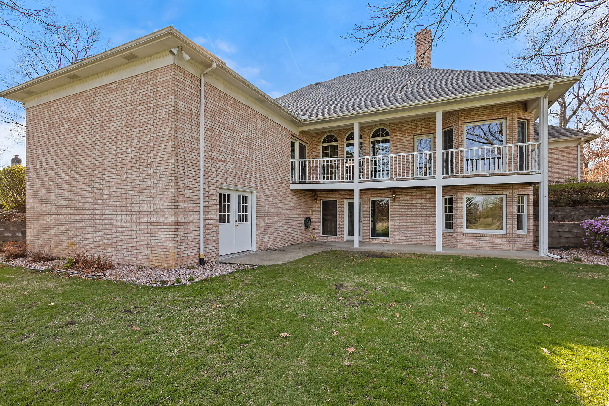 6664 Ridgeview Drive Demotte, IN 46310 - Photo 51 of 65 a front view of a house with a garden