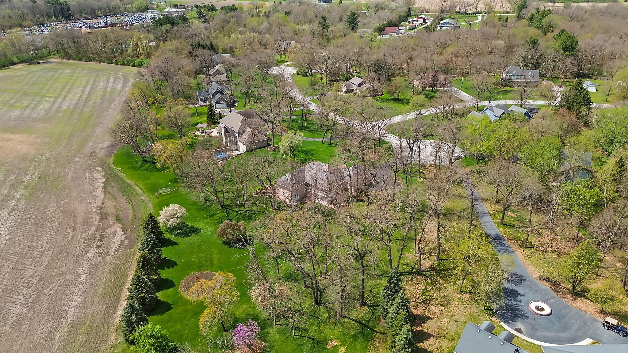 6664 Ridgeview Drive Demotte, IN 46310 - Photo 58 of 65 an aerial view of residential house with outdoor space and trees all around