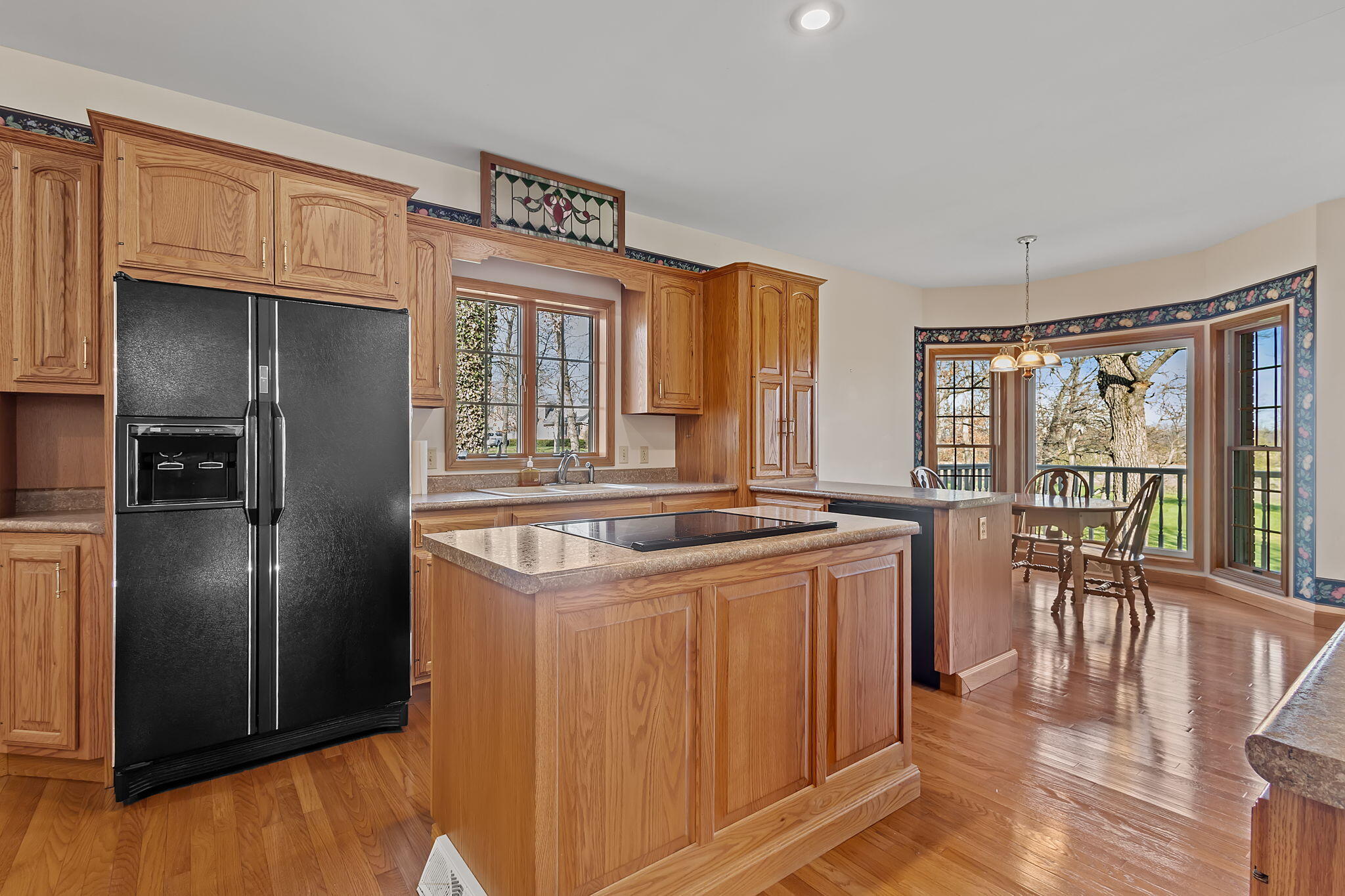 6664 Ridgeview Drive Demotte, IN 46310 - Photo 8 of 65 a kitchen with stainless steel appliances granite countertop a refrigerator and a stove