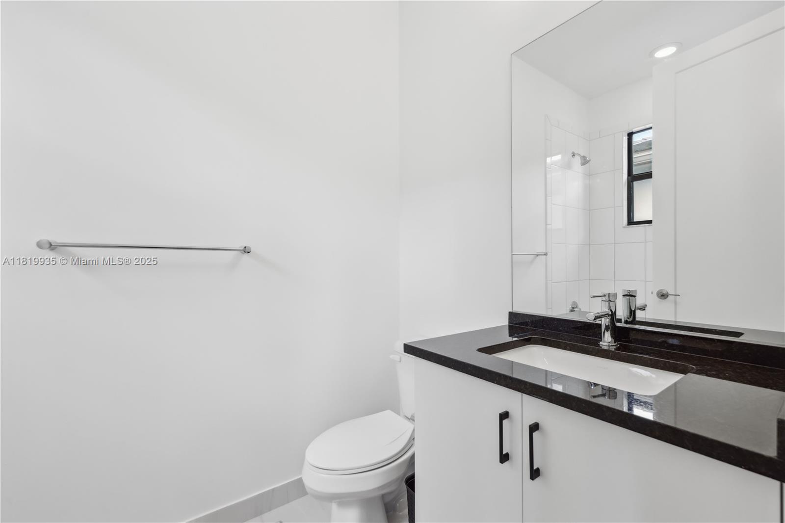 20273 Bandon Dunes Road Boca Raton, FL 33434 - Photo 47 of 73 a bathroom with a sink and a toilet