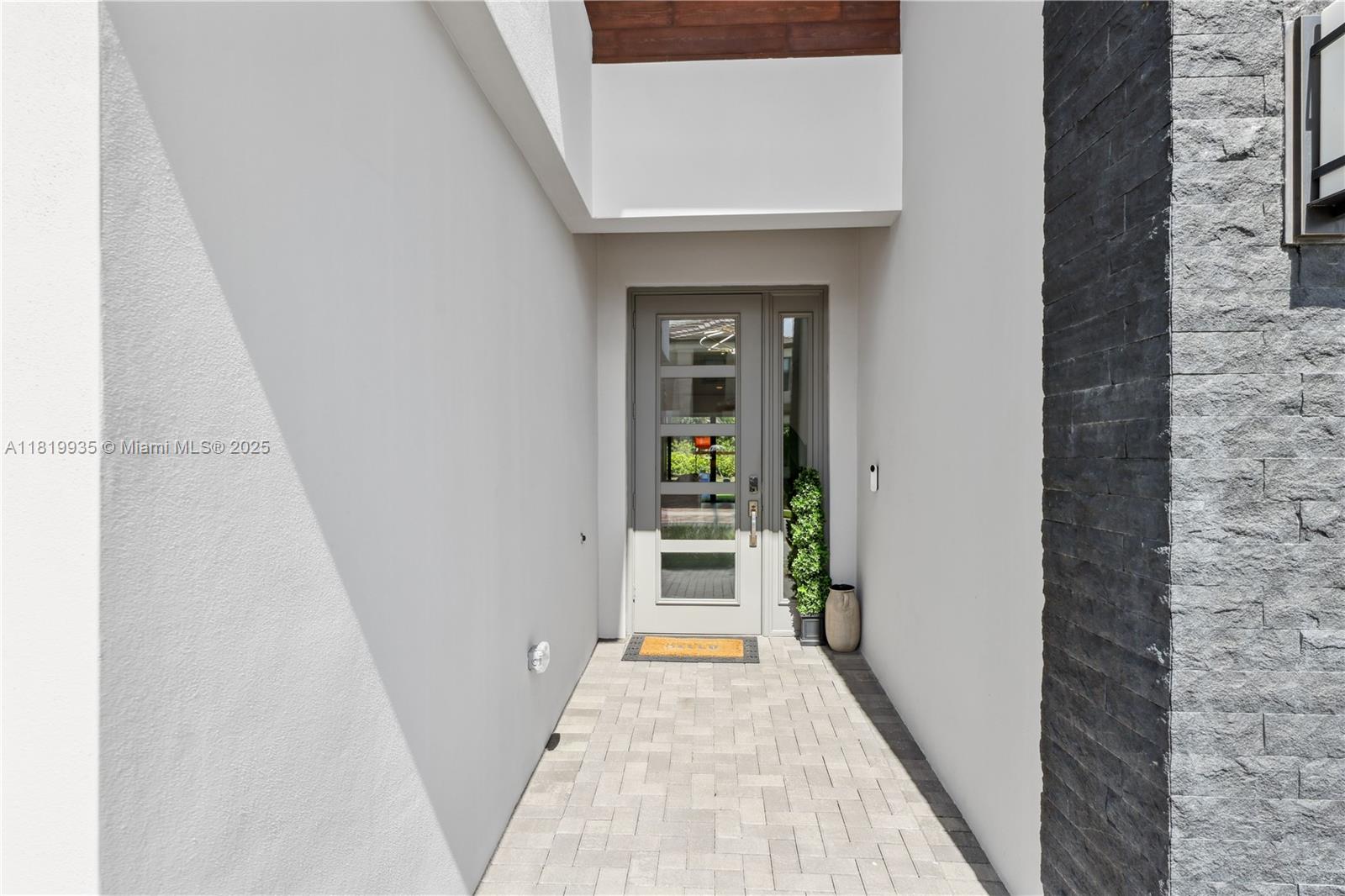 20273 Bandon Dunes Road Boca Raton, FL 33434 - Photo 7 of 73 a view of a hallway with wooden floor and staircase