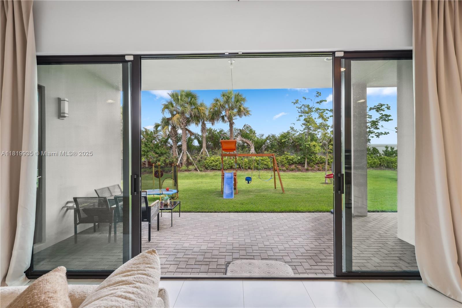 20273 Bandon Dunes Road Boca Raton, FL 33434 - Photo 8 of 73 a view of a living room and a floor to ceiling window