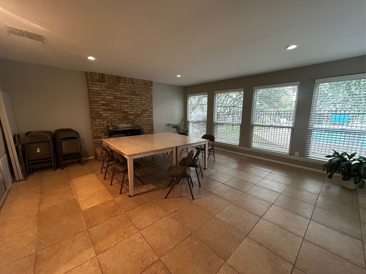 8210 Bent Tree Road, Unit 247 Austin, TX 78759 - Photo 20 of 21 This room features tiled flooring, a brick fireplace, and recessed lighting