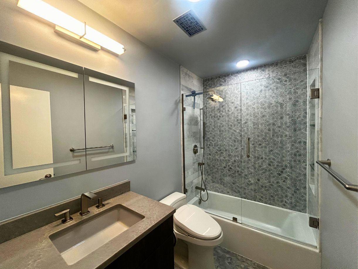 8210 Bent Tree Road, Unit 247 Austin, TX 78759 - Photo 5 of 21 This bathroom features a contemporary vanity with a stone countertop and a modern sink faucet