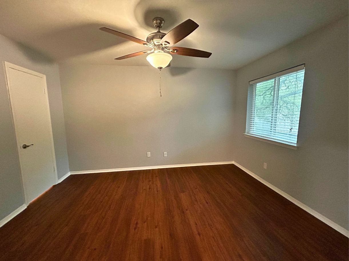 8210 Bent Tree Road, Unit 247 Austin, TX 78759 - Photo 9 of 21 This room features rich wood-look flooring, light-colored walls, and a window with blinds