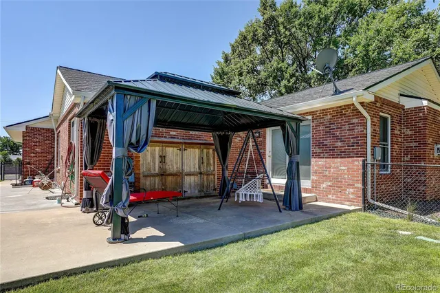 a view of outdoor space with porch and wooden fence