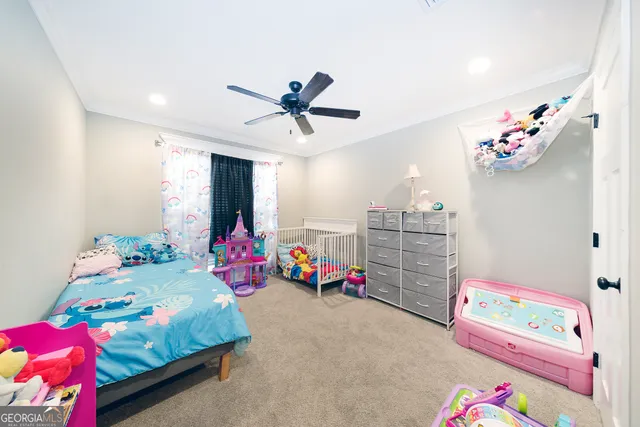 a bedroom with toys and a bed
