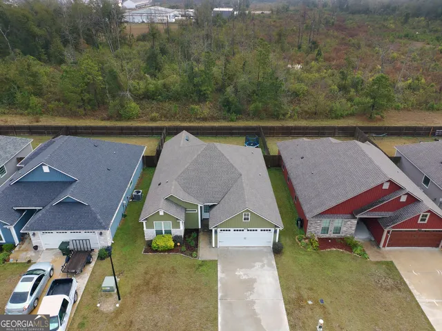 an aerial view of a house with pool lake view and mountain view