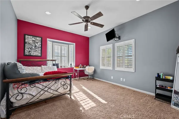 a bedroom with furniture and a window