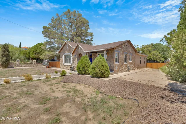 a view of house with yard