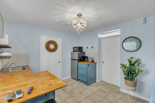 a view of a hallway with entryway and windows