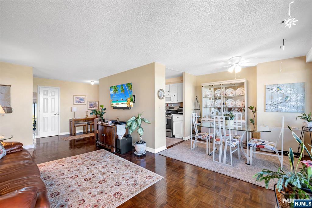 277 Prospect Avenue, Unit 10B Hackensack, NJ 07601 - Photo 12 of 34 a living room with furniture and a flat screen tv