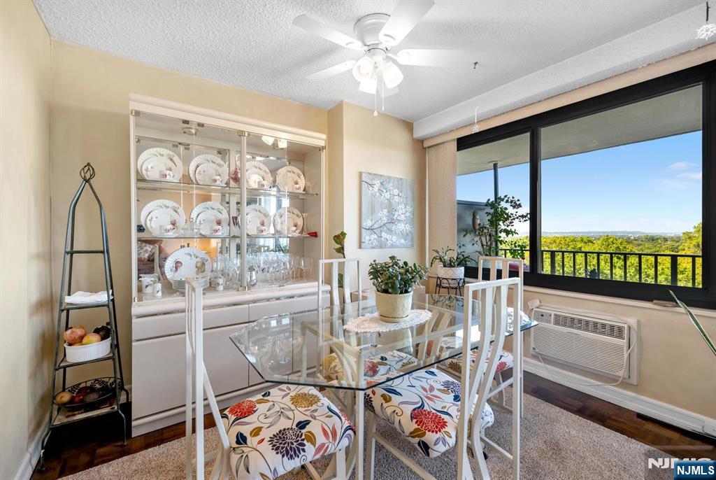 277 Prospect Avenue, Unit 10B Hackensack, NJ 07601 - Photo 15 of 34 a living room with furniture and a floor to ceiling window