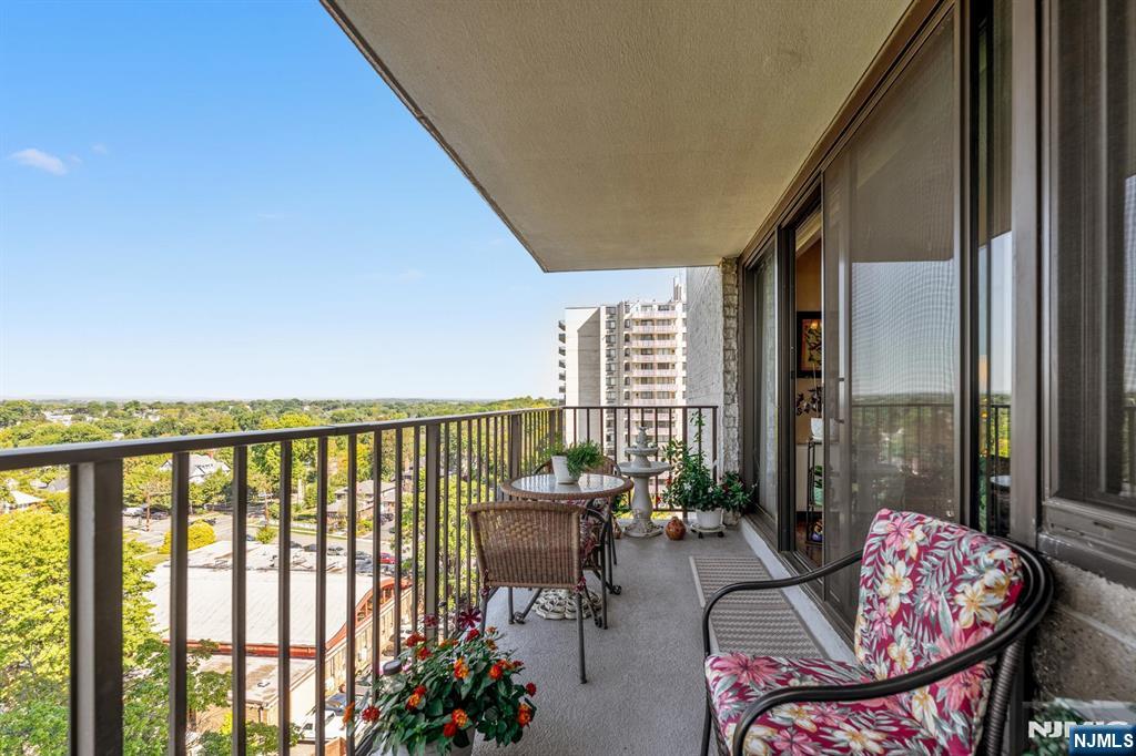 277 Prospect Avenue, Unit 10B Hackensack, NJ 07601 - Photo 23 of 34 a balcony with furniture and a potted plant