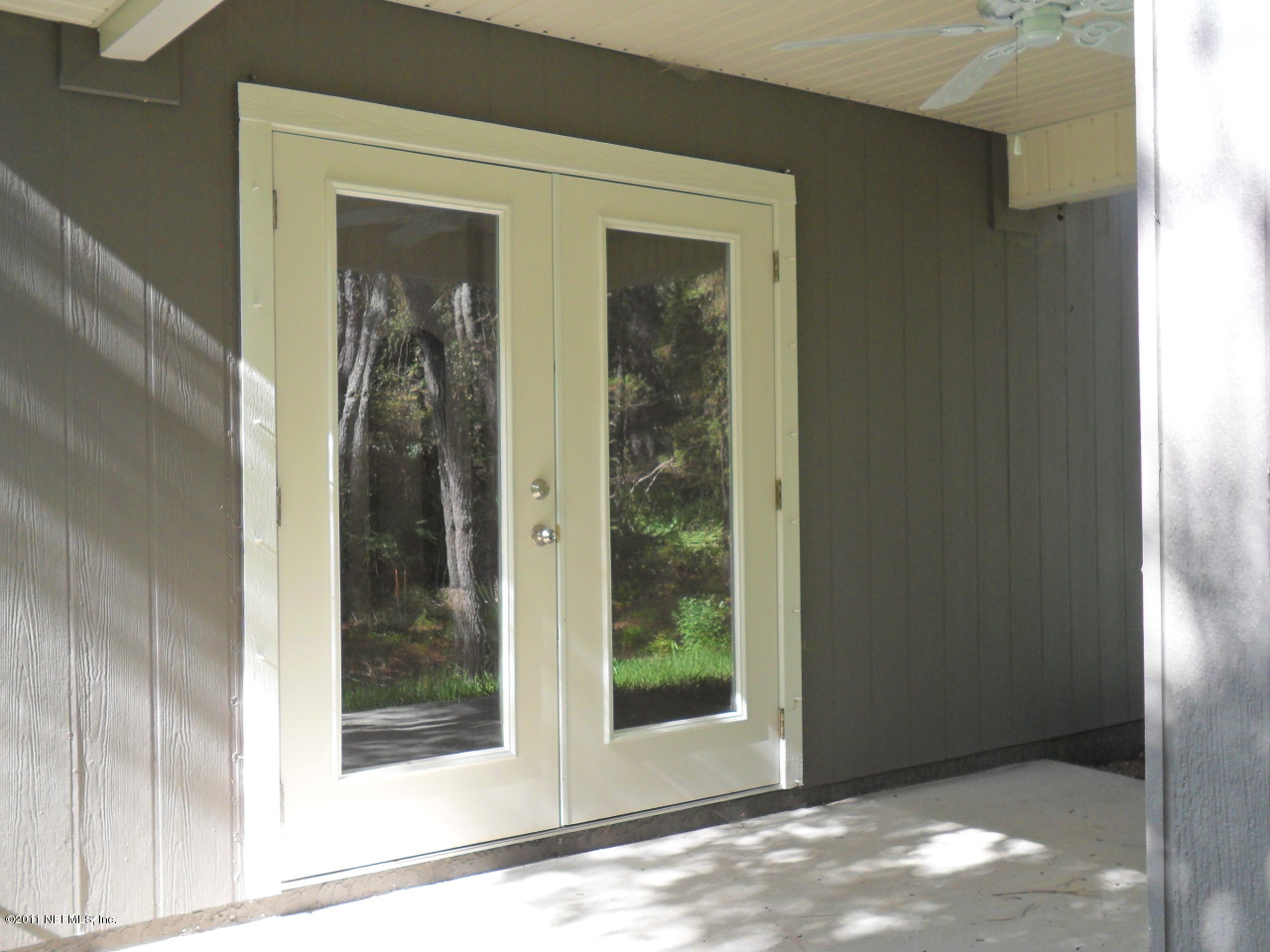 97218 Bluff View Circle, Unit ROSES BLUFF LOT 37 Yulee, FL 32097 - Photo 11 of 52 a view of a glass door with a glass door