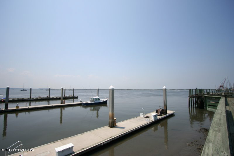 97218 Bluff View Circle, Unit ROSES BLUFF LOT 37 Yulee, FL 32097 - Photo 29 of 52 a view of a lake with boats and trees in the background