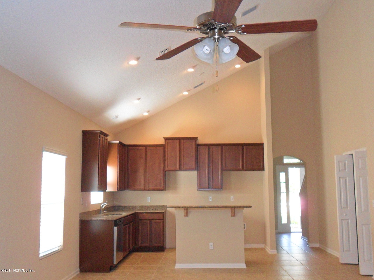 97218 Bluff View Circle, Unit ROSES BLUFF LOT 37 Yulee, FL 32097 - Photo 8 of 52 a kitchen with stainless steel appliances kitchen island granite countertop a refrigerator a sink and dishwasher