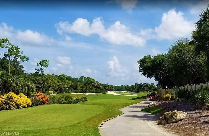 a view of a golf course with a fountain