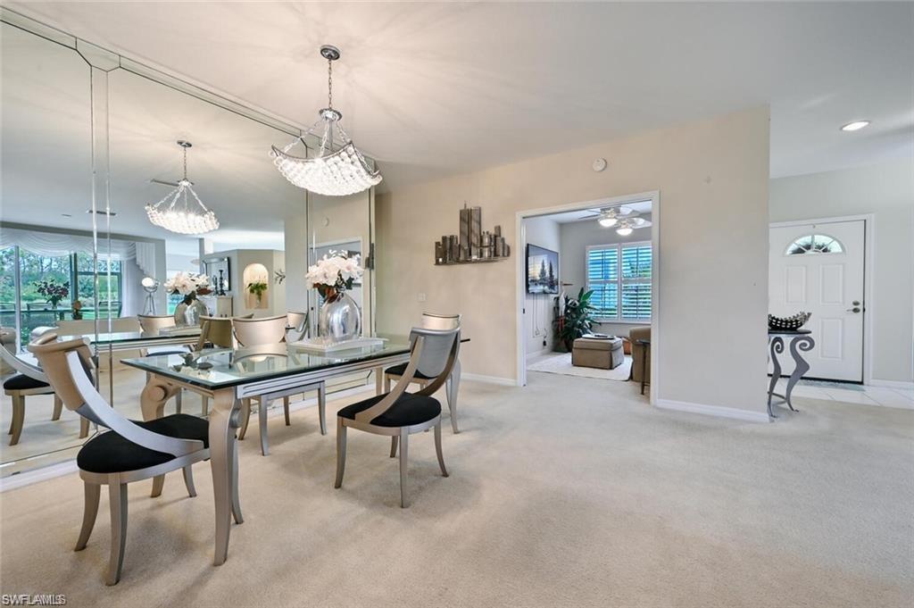 6065 Pinnacle Lane, Unit 1001 Naples, FL 34110 - Photo 16 of 26 a view of a dining room with furniture