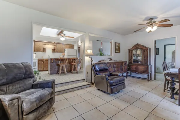 a view of a livingroom with furniture and a stove