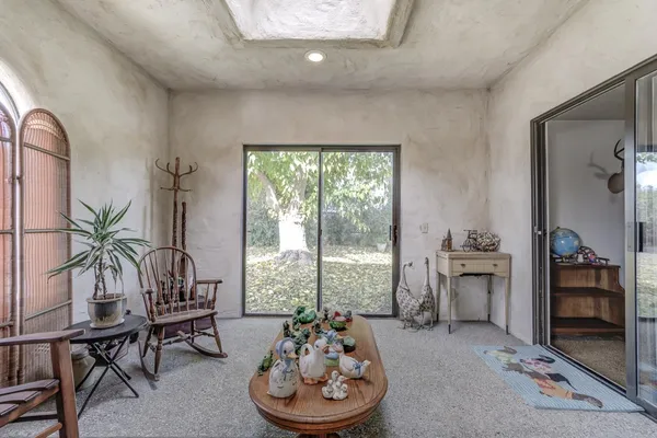 a bedroom with a bed and a table in it