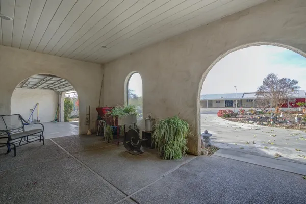 front view of a house with potted plants