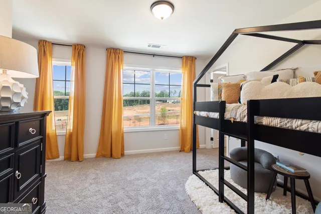 a living room with furniture and a table