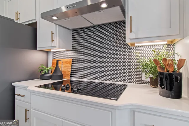 a kitchen with a sink and cabinets