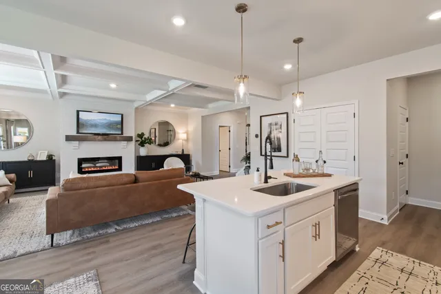 a view of a a dining room with furniture window and wooden floor