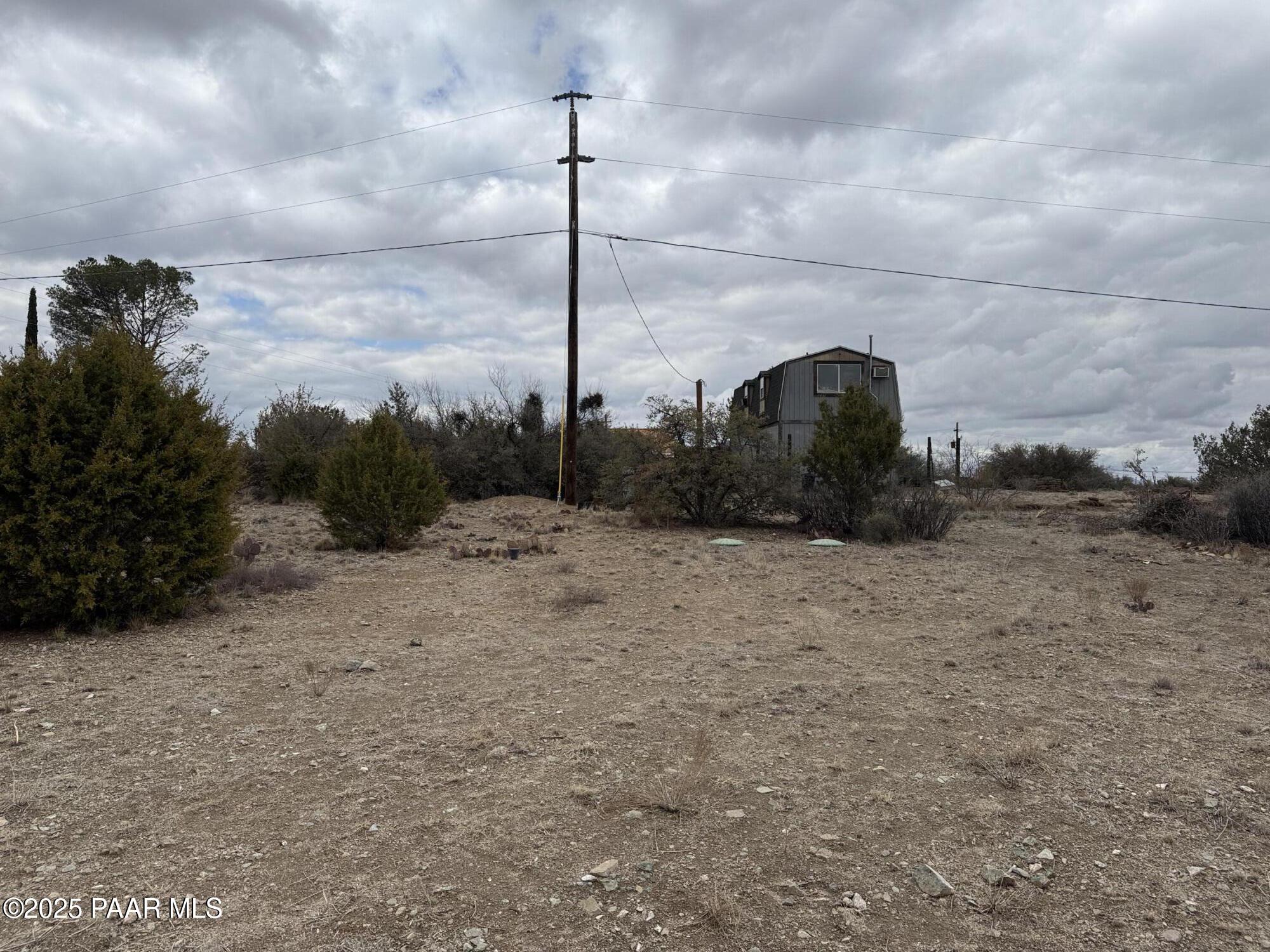 20546 East Antelope Road Mayer, AZ 86333 - Photo 5 of 10 a view of a dry yard with wooden fence