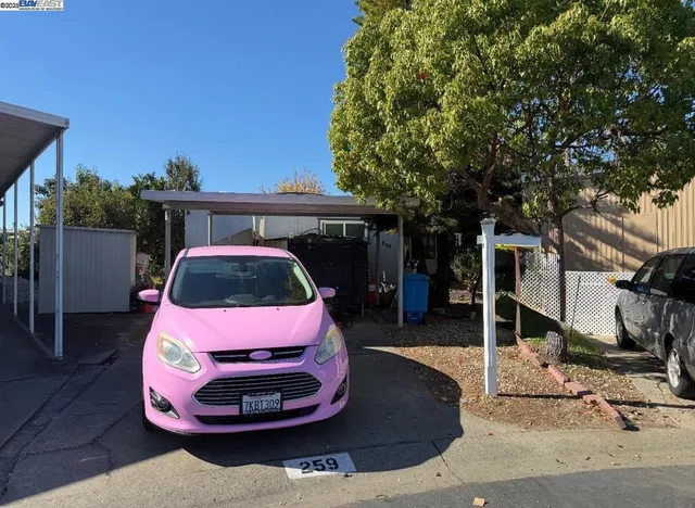 a car parked in front of a house