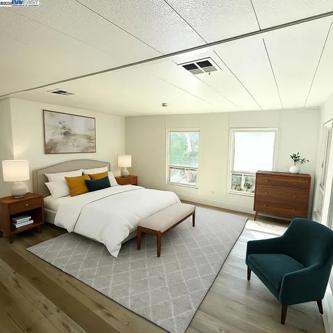 a bedroom with a bed and couch