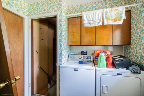 a utility room with a window dryer and washer