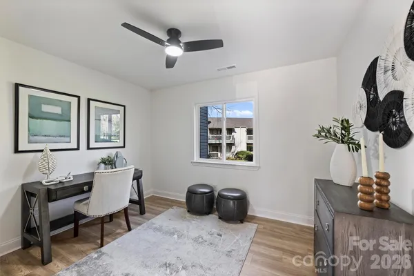 a bathroom with a toilet a sink a mirror and tub