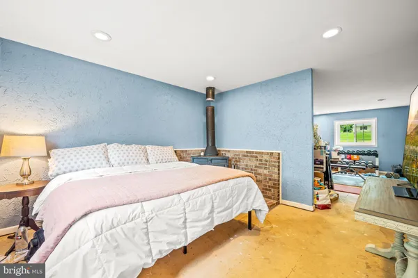 a bedroom with bed and a night stand