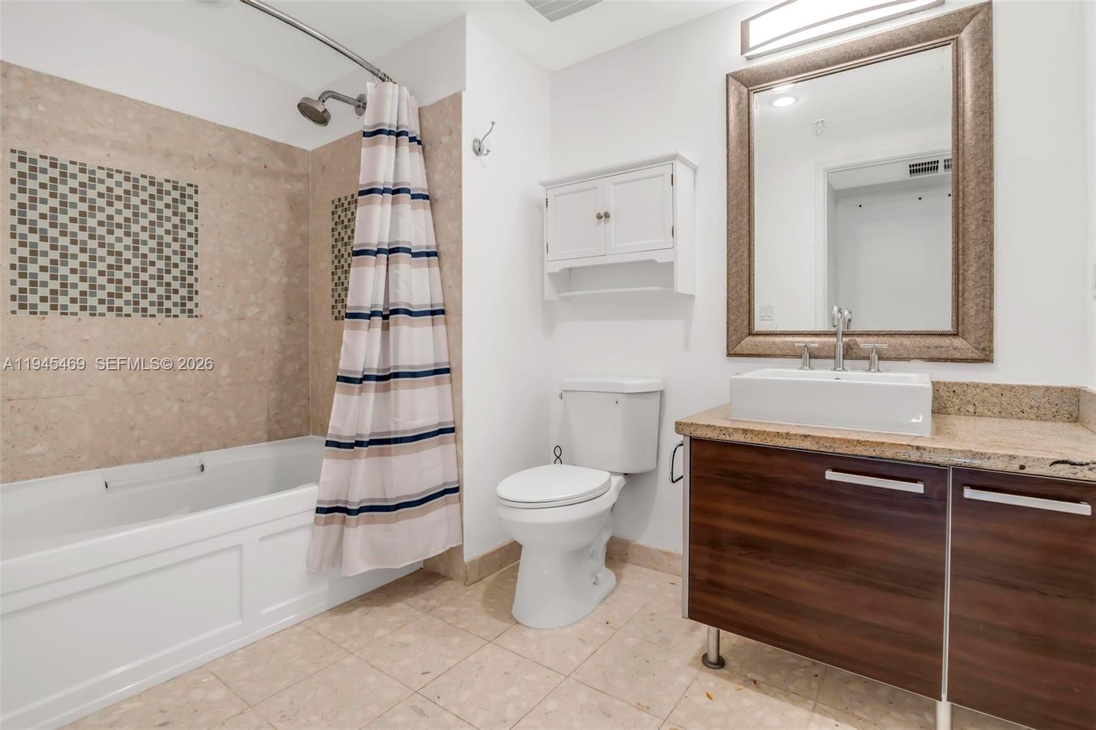 185 Southwest 7th Street, Unit 3508 Miami, FL 33130 - Photo 15 of 62 a bathroom with a sink toilet and shower